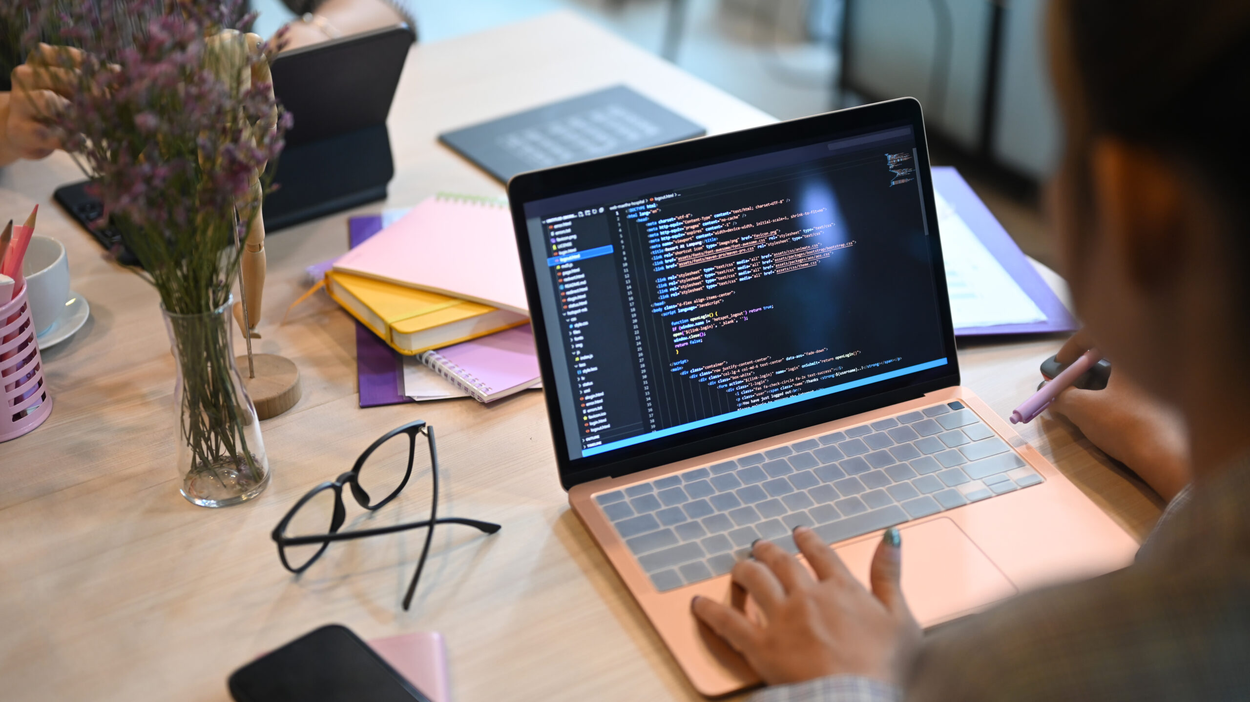 a person working on website development on a laptop