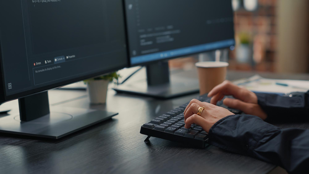 person working on website maintenance on a pc