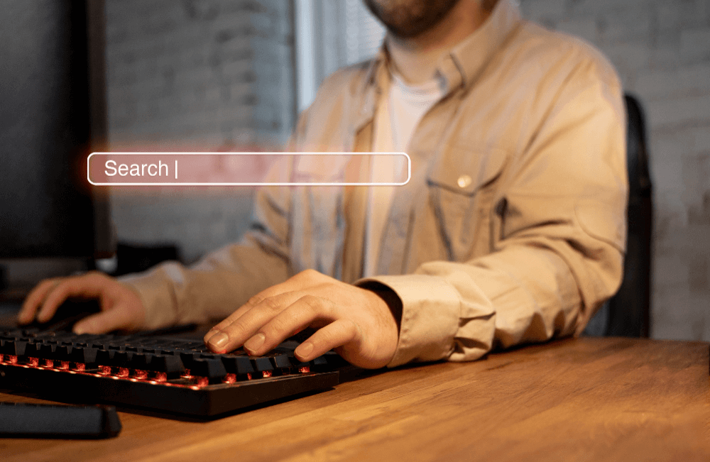 a man typing on a keyboard